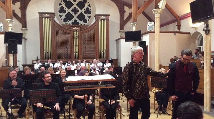 Ben Lunn takes a bow alongside MD Richard Ingham at the premiere on 26 March