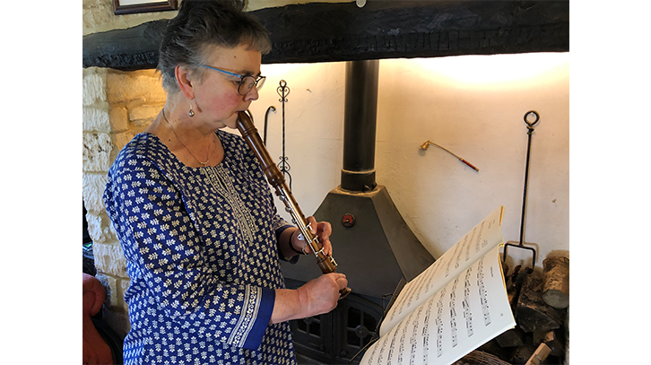 woman playing an adapted recorder