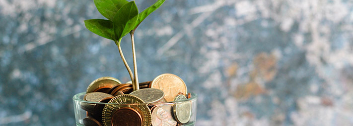 Glass jar with coins inside