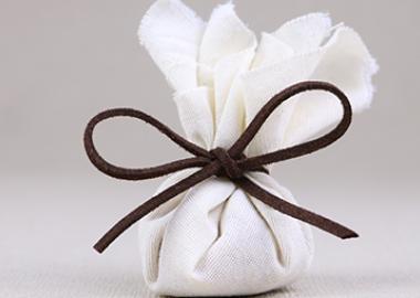 white parcel tied up with a bow